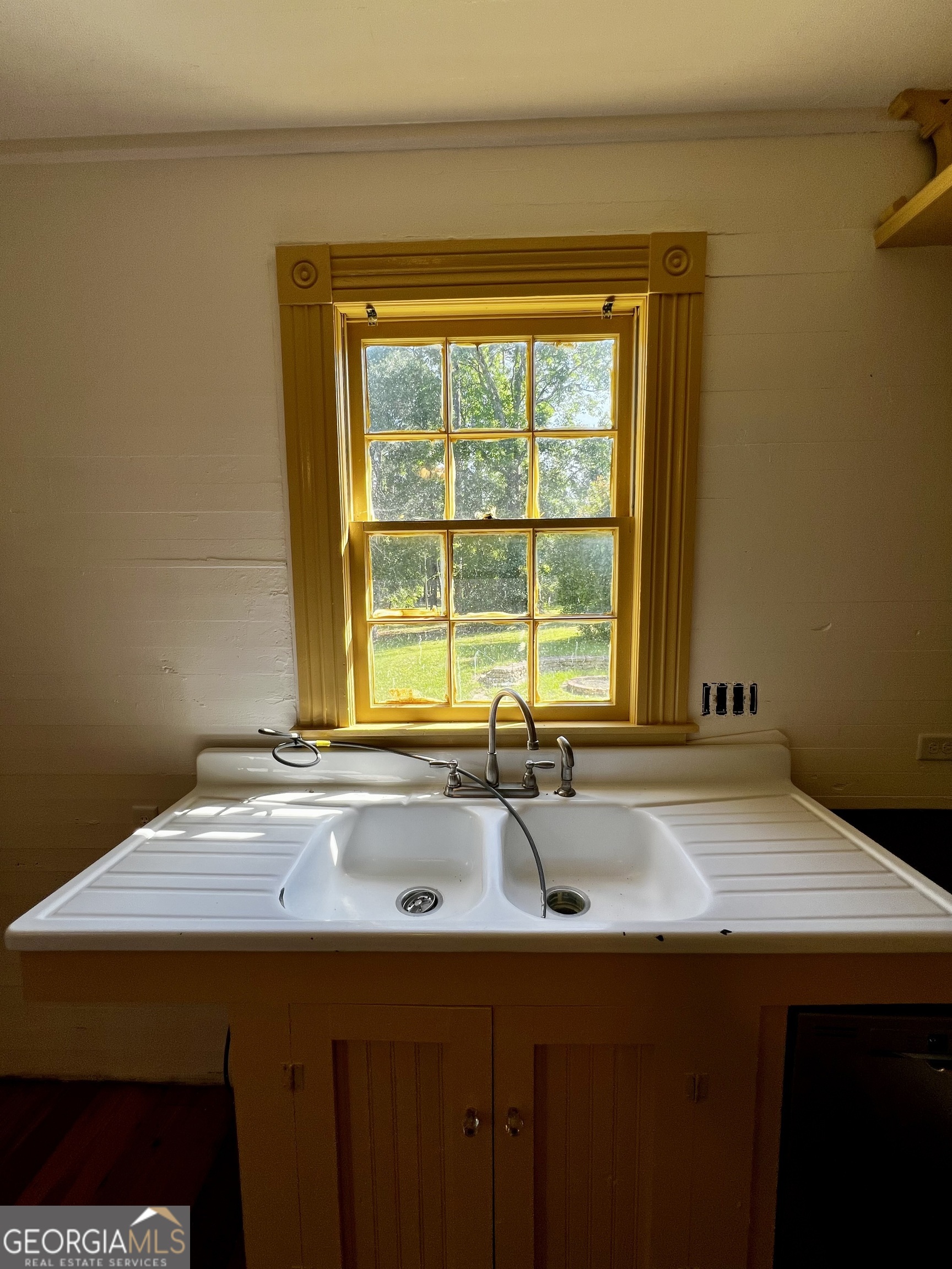 1311 3rd Street Dudley, GA 31022 - Photo 28 of 43 a bathroom with a sink and a window