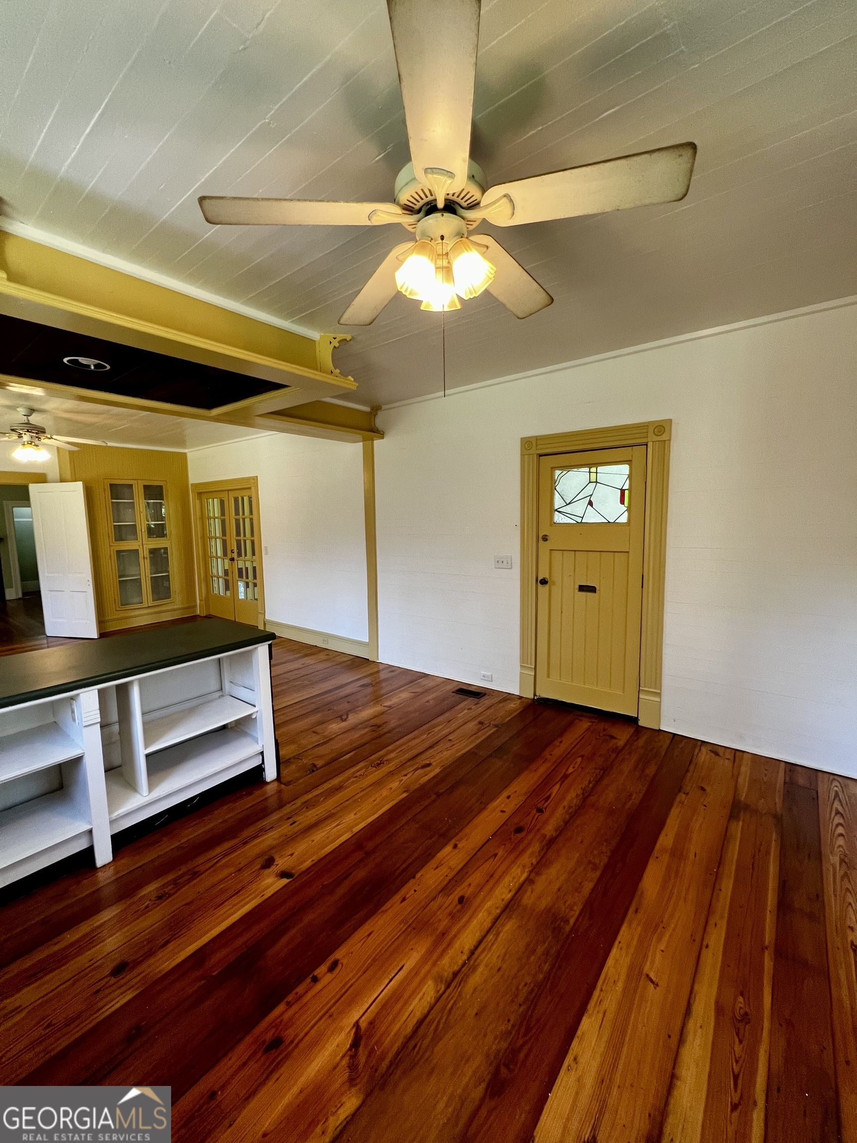 1311 3rd Street Dudley, GA 31022 - Photo 29 of 43 a view of an empty room with wooden floor and fan