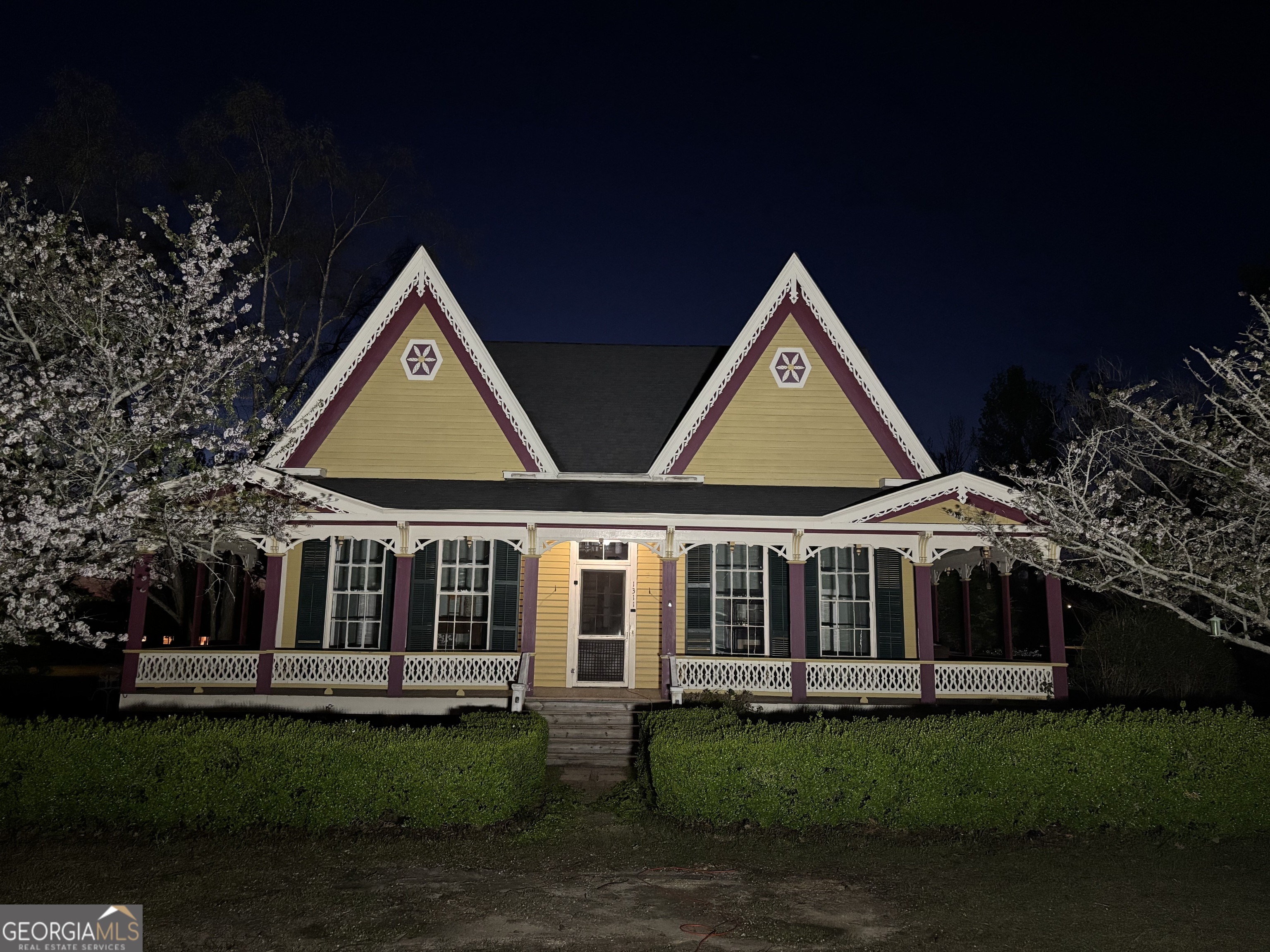 1311 3rd Street Dudley, GA 31022 - Photo 5 of 43 a front view of a house with a garden