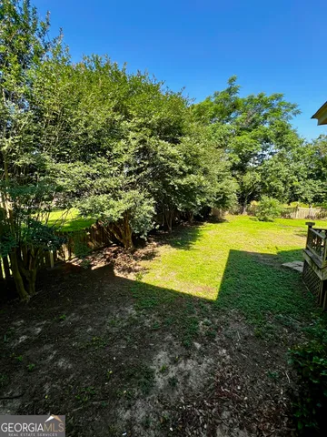 a view of a yard with an outdoor space
