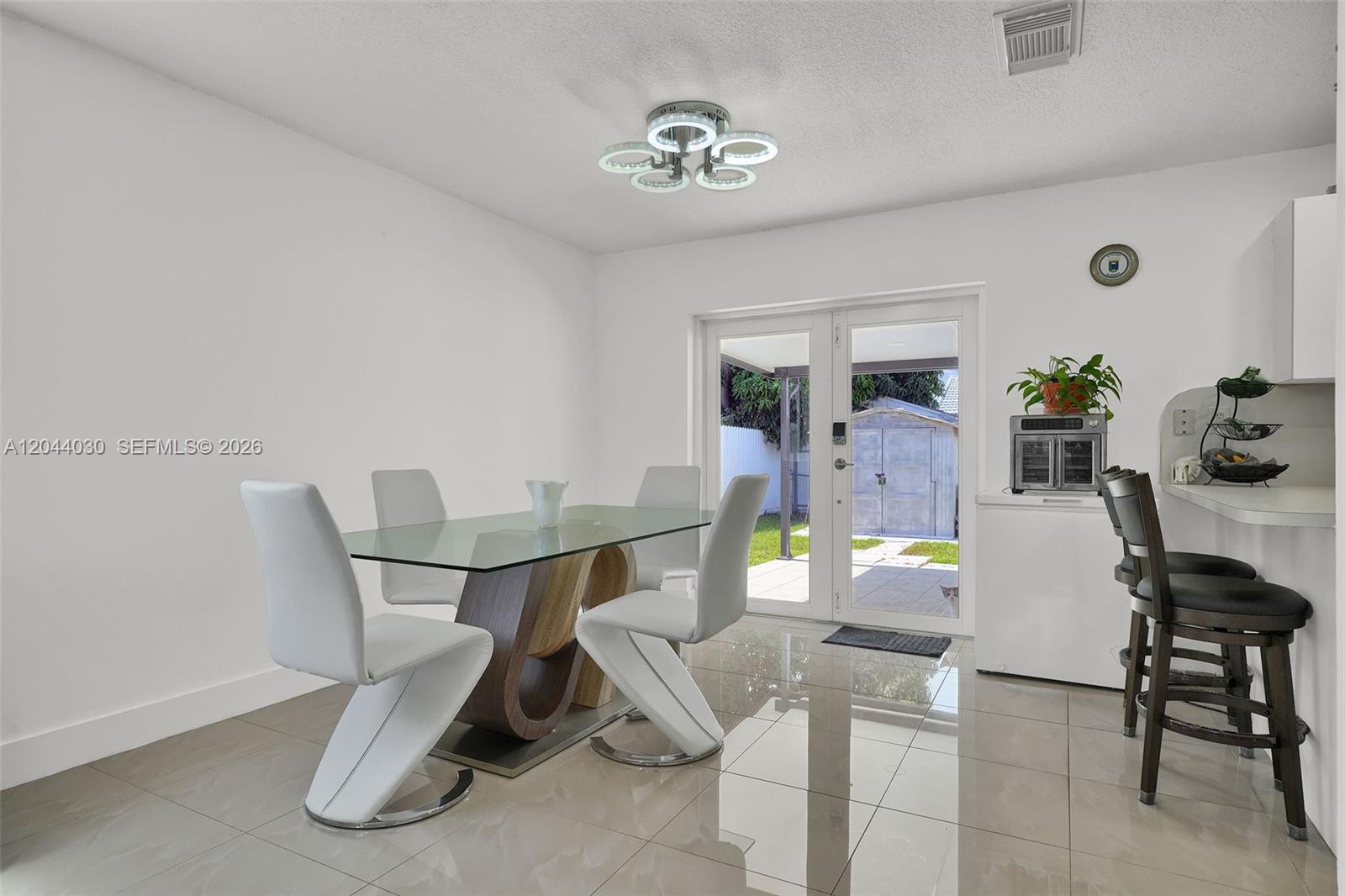12551 Southwest 223rd Street Miami, FL 33170 - Photo 6 of 35 a living room with furniture and white table