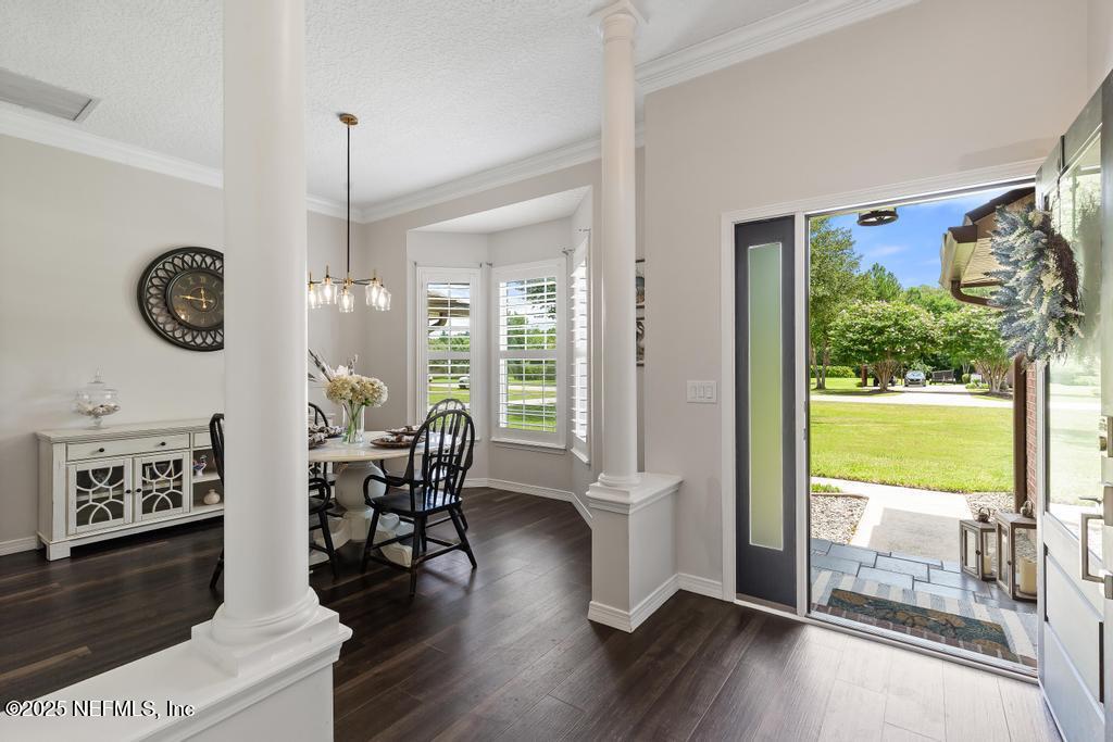 44677 Green Meadows Lane Callahan, FL 32011 - Photo 16 of 91 a view of a dining room with furniture window and wooden floor