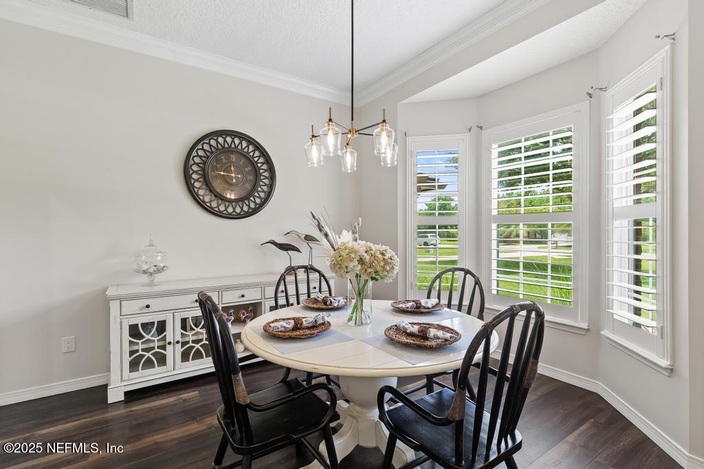 44677 Green Meadows Lane Callahan, FL 32011 - Photo 18 of 91 a view of a dining room with furniture window and wooden floor