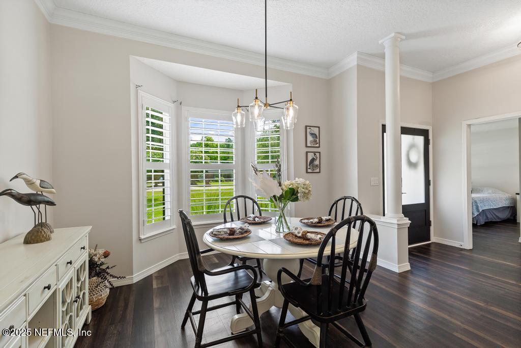 44677 Green Meadows Lane Callahan, FL 32011 - Photo 19 of 91 a view of a dining room with furniture window and wooden floor