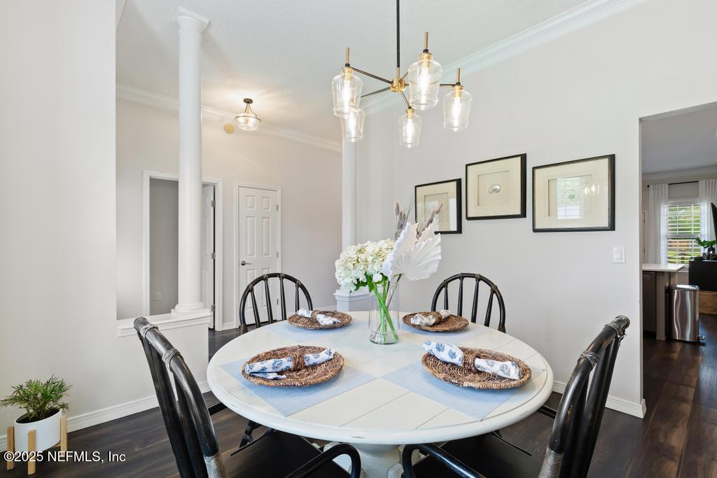 44677 Green Meadows Lane Callahan, FL 32011 - Photo 21 of 91 a view of a dining room with furniture and chandelier