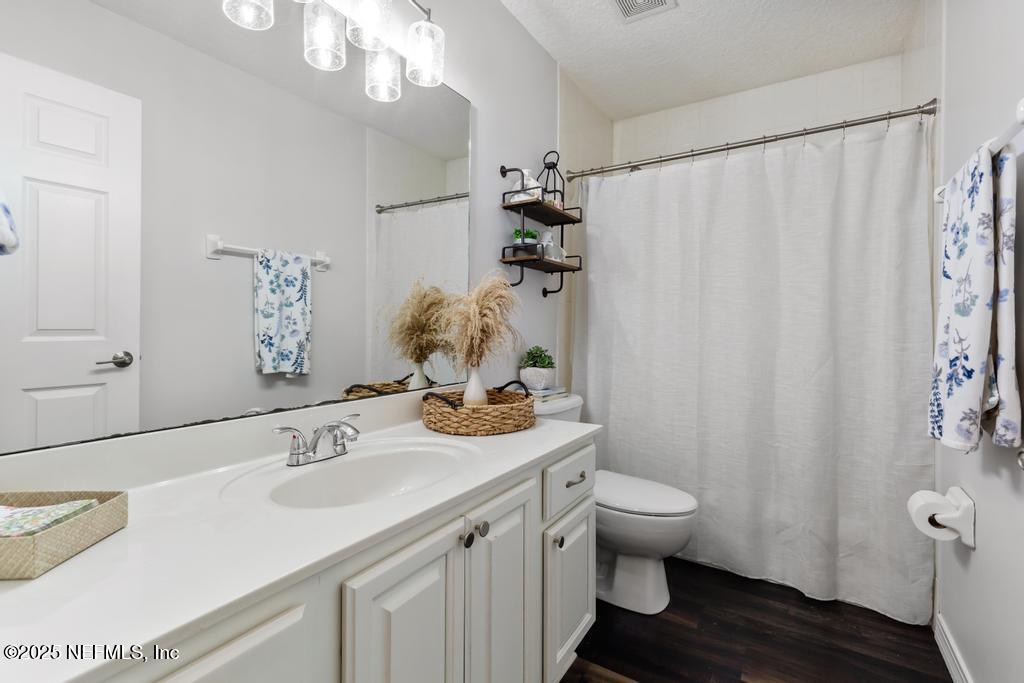 44677 Green Meadows Lane Callahan, FL 32011 - Photo 26 of 91 a bathroom with a sink toilet and shower