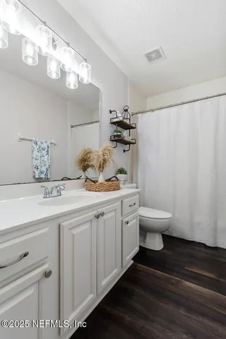 a kitchen with stainless steel appliances kitchen island granite countertop a sink and cabinets