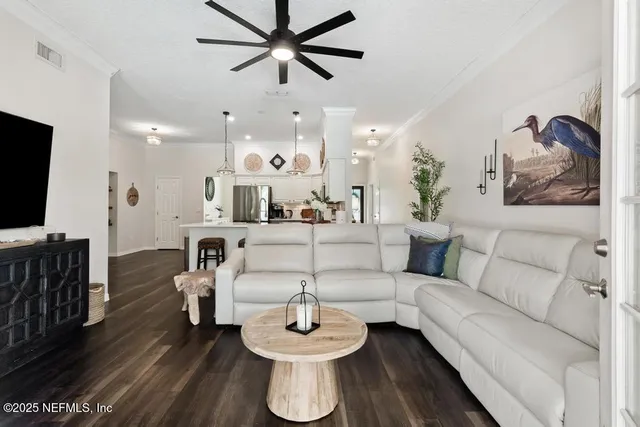 a bedroom with a bed and dresser with mirror