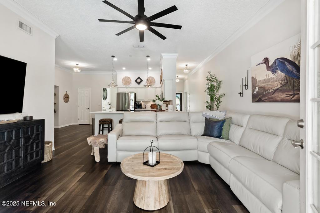 44677 Green Meadows Lane Callahan, FL 32011 - Photo 32 of 91 a living room with furniture and a flat screen tv