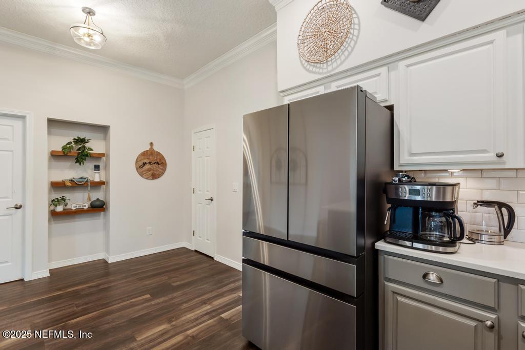 44677 Green Meadows Lane Callahan, FL 32011 - Photo 39 of 91 a kitchen with a refrigerator and a sink