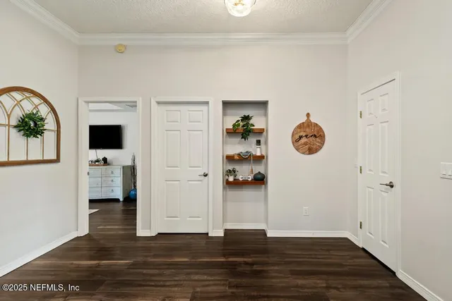 a view of a patio with a table and chairs
