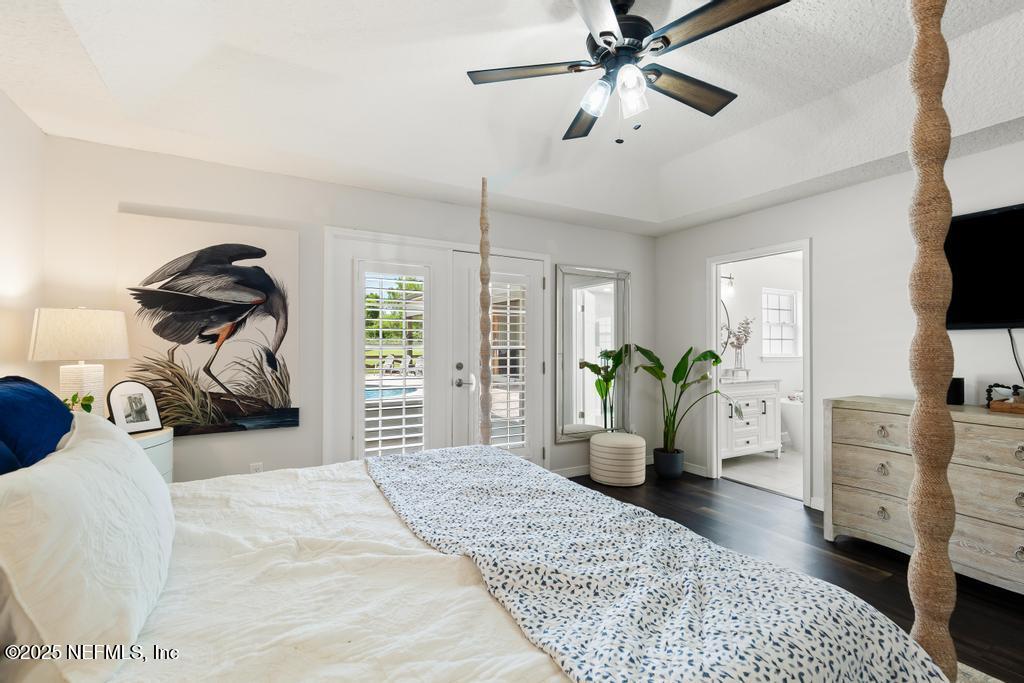 44677 Green Meadows Lane Callahan, FL 32011 - Photo 43 of 91 a bedroom with a bed and a flat tv screen on dresser