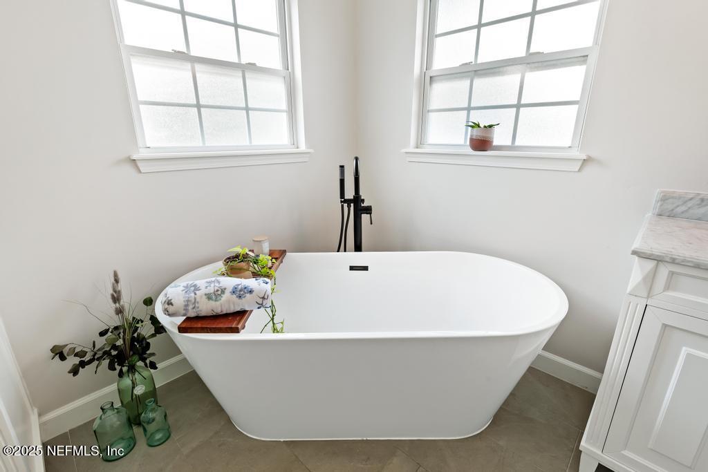 44677 Green Meadows Lane Callahan, FL 32011 - Photo 48 of 91 a white bath tub sitting next to a window