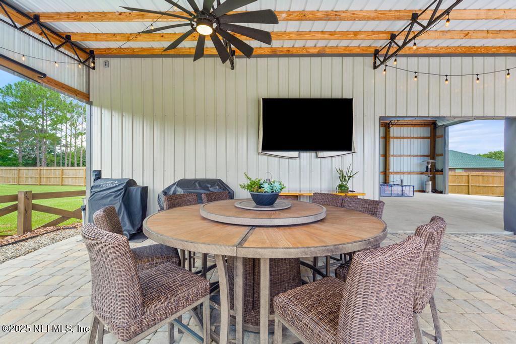 44677 Green Meadows Lane Callahan, FL 32011 - Photo 65 of 91 a view of a dining room with furniture window and wooden floor