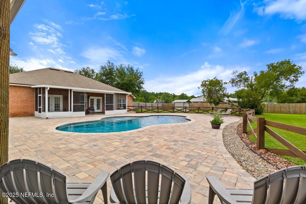 44677 Green Meadows Lane Callahan, FL 32011 - Photo 67 of 91 a view of a house with swimming pool and sitting area