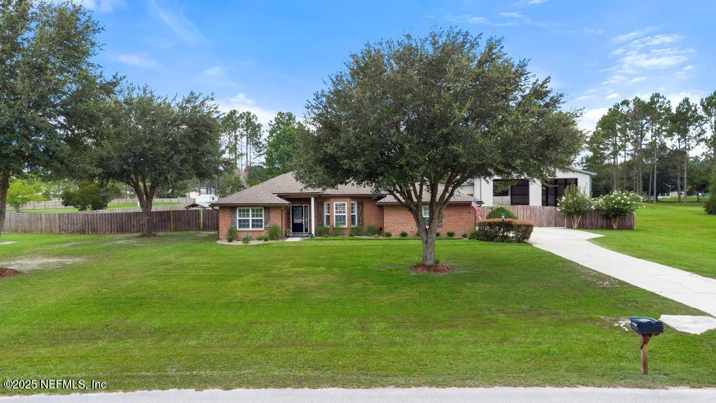 44677 Green Meadows Lane Callahan, FL 32011 - Photo 7 of 91 a front view of a house with a yard
