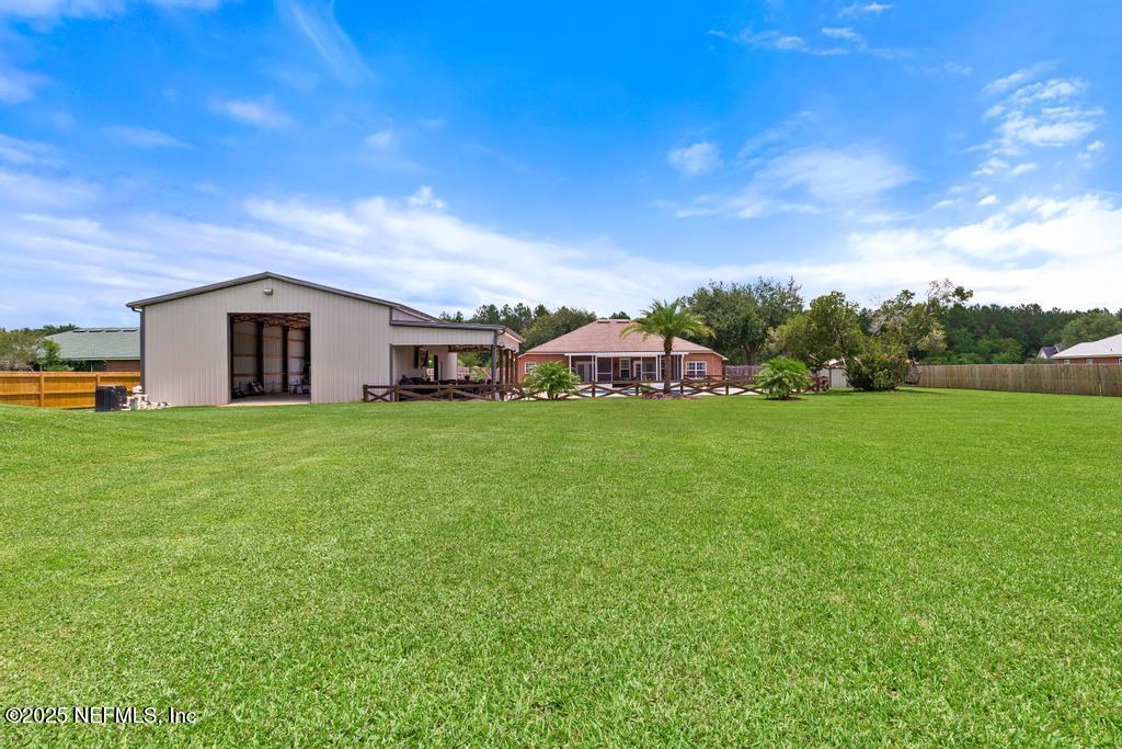 44677 Green Meadows Lane Callahan, FL 32011 - Photo 71 of 91 a view of a house with a yard