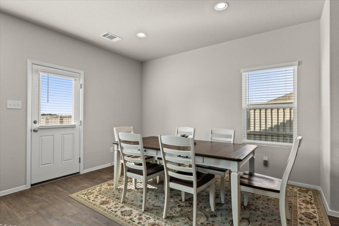 1296 Teychas Drive Kyle, TX 78640 - Photo 13 of 39 a view of a dining room with furniture and window