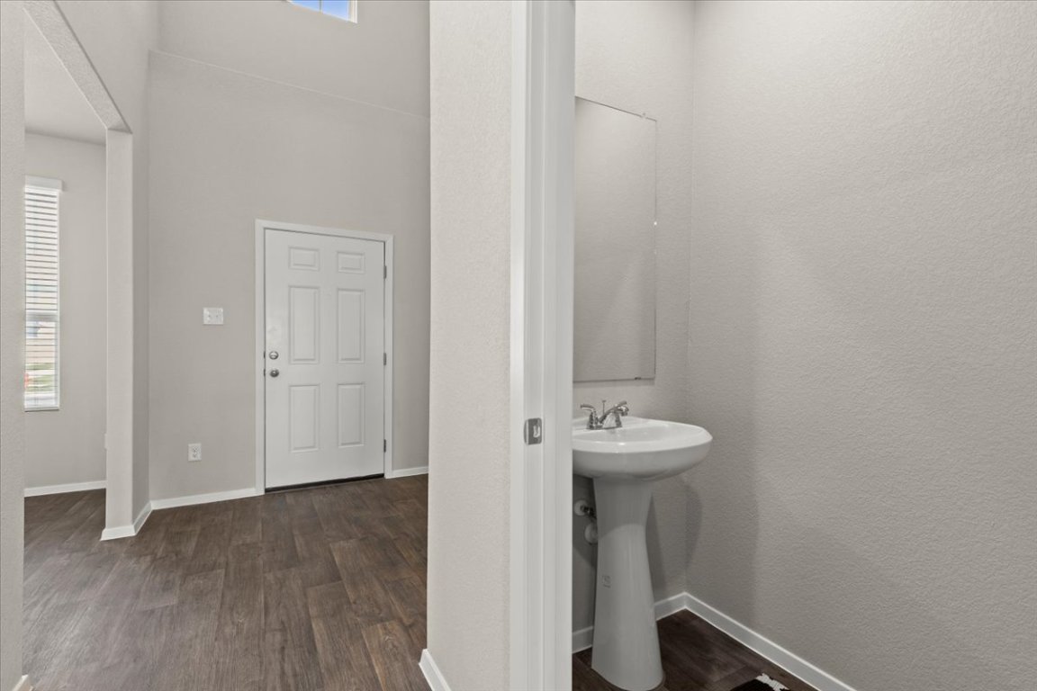1296 Teychas Drive Kyle, TX 78640 - Photo 27 of 39 a bathroom with a sink and a mirror