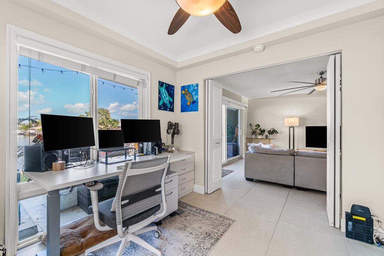 2311 Northeast 36th Street, Unit 1A Lighthouse Point, FL 33064 - Photo 15 of 29 a workspace with furniture and window
