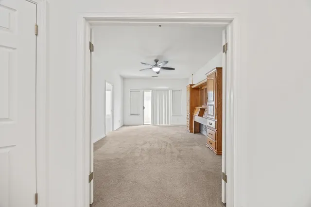 a view of a livingroom with a ceiling fan