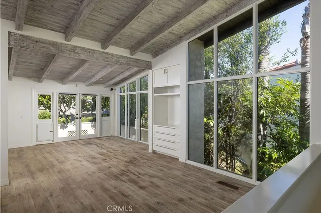 a view of a porch with wooden floor and outer view