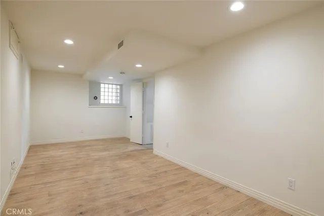 a kitchen with granite countertop a sink and cabinets