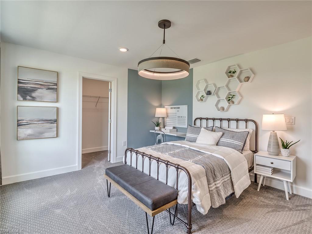 15635 Northridge Road Punta Gorda, FL 33982 - Photo 25 of 49 a bedroom with a bed and a table