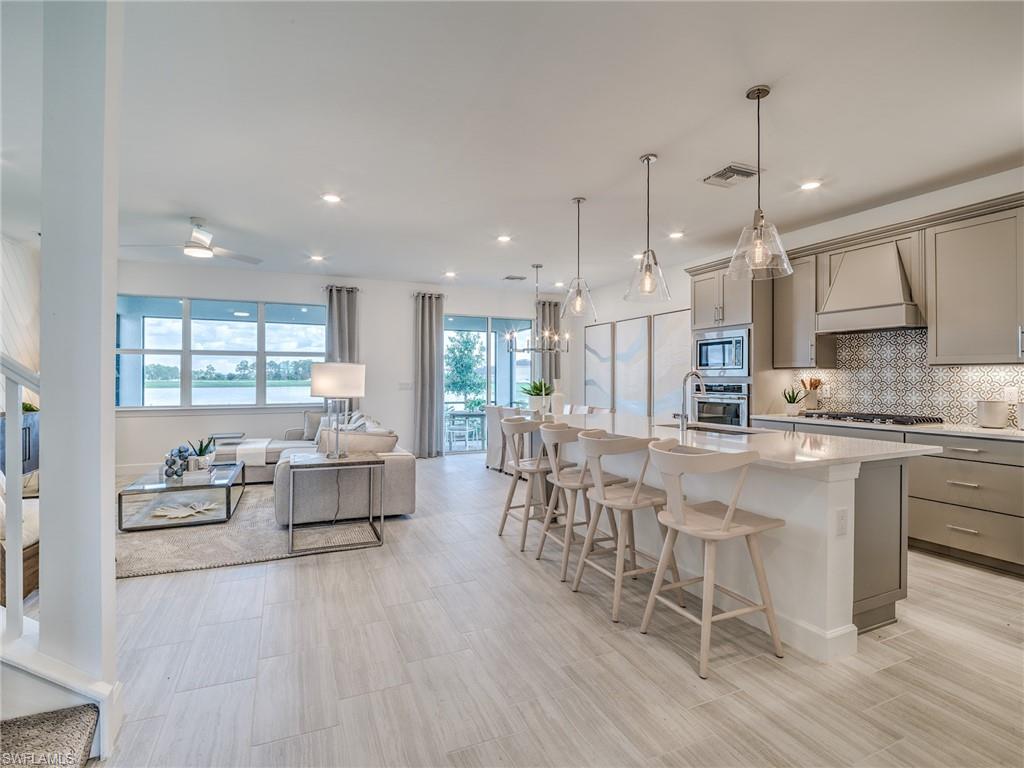 15635 Northridge Road Punta Gorda, FL 33982 - Photo 7 of 49 a large white kitchen with lots of furniture and appliances