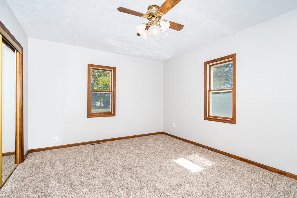 25265 South Chicago Road Elwood, IL 60421 - Photo 11 of 16 an empty room with a window and a ceiling fan