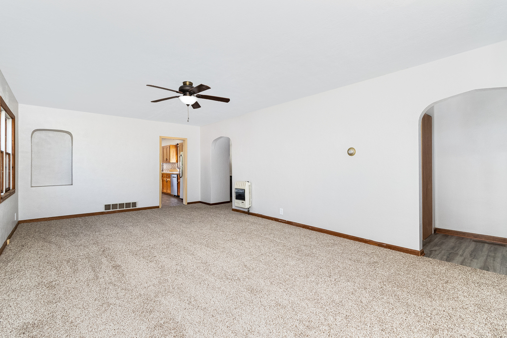 25265 South Chicago Road Elwood, IL 60421 - Photo 3 of 16 an empty room with chandelier fan and windows