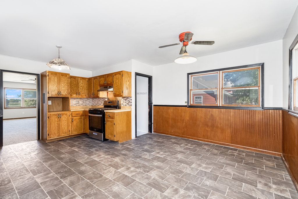25265 South Chicago Road Elwood, IL 60421 - Photo 7 of 16 a kitchen with granite countertop a stove a refrigerator and a sink