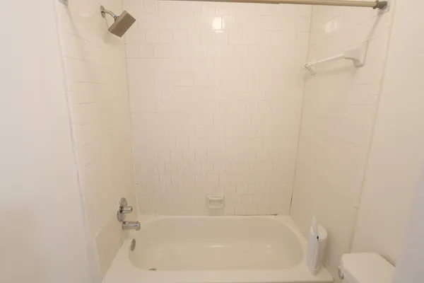 a close up of a bathtub curtain