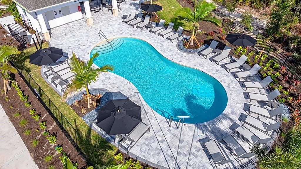 6917 Prairie Oak Way Nokomis, FL 34275 - Photo 19 of 28 a view of a swimming pool with sitting area