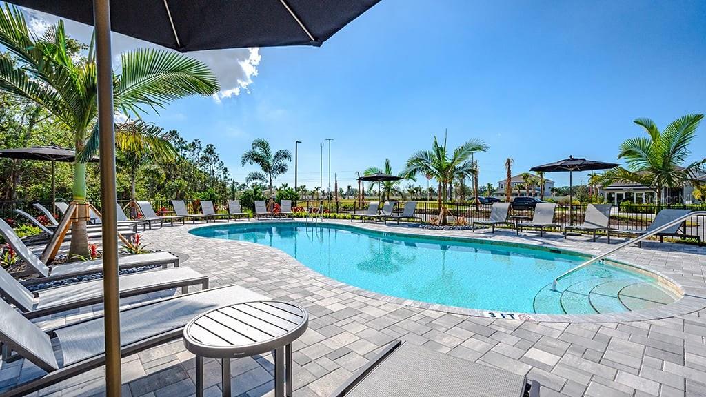 6917 Prairie Oak Way Nokomis, FL 34275 - Photo 21 of 28 a view of a swimming pool with a lounge chairs