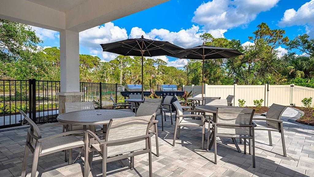 6917 Prairie Oak Way Nokomis, FL 34275 - Photo 25 of 28 a view of an outdoor sitting area with furniture