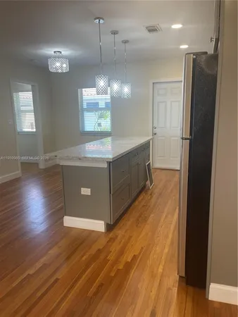 a view of a kitchen from the hallway