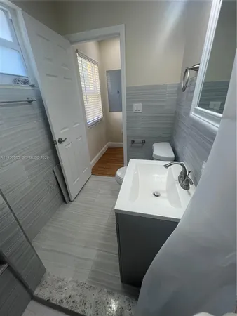 a bathroom with a sink and mirror