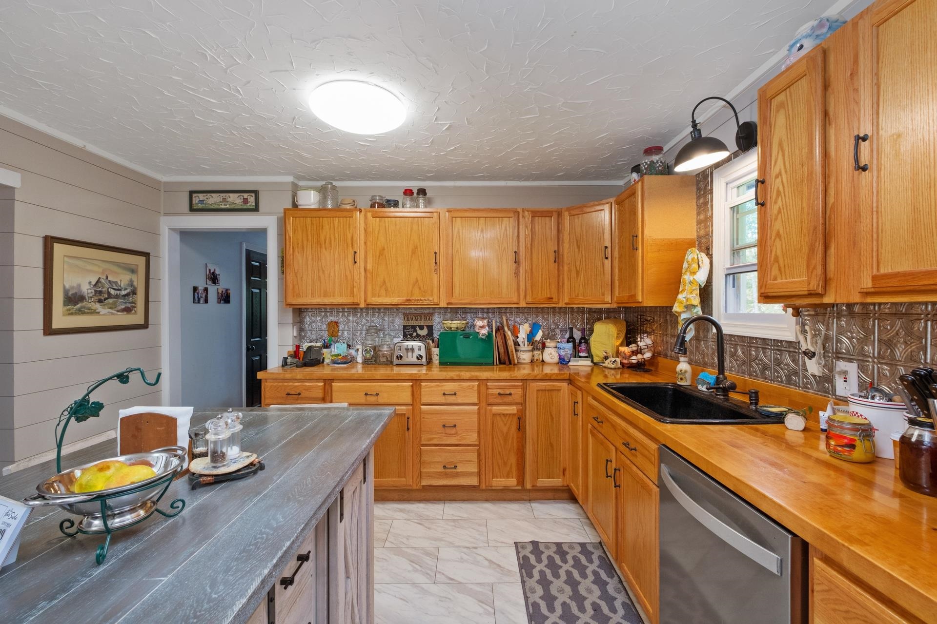 65 Cubbley Road Hot Springs, VA 24445 - Photo 11 of 56 a kitchen with a sink stove and cabinets