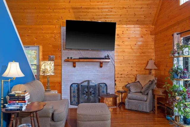 a outdoor living space with furniture and a fireplace