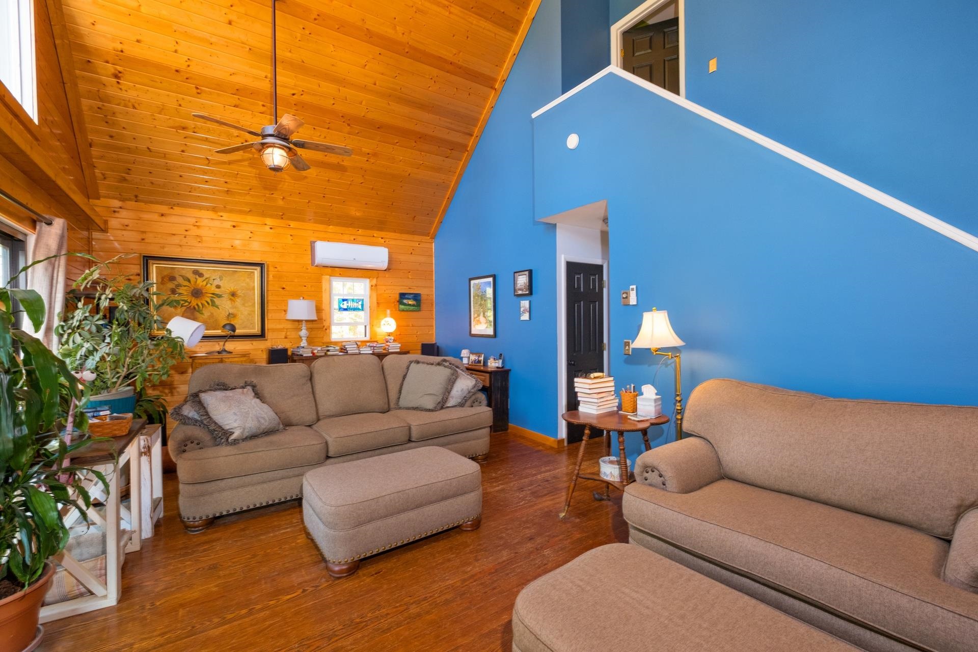 65 Cubbley Road Hot Springs, VA 24445 - Photo 18 of 56 a living room with furniture and a chandelier