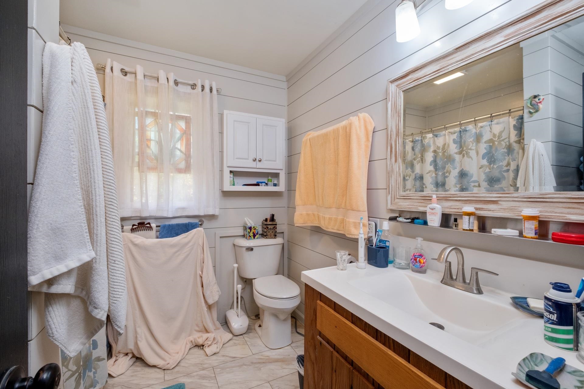 65 Cubbley Road Hot Springs, VA 24445 - Photo 21 of 56 a bathroom with a sink a toilet and a mirror