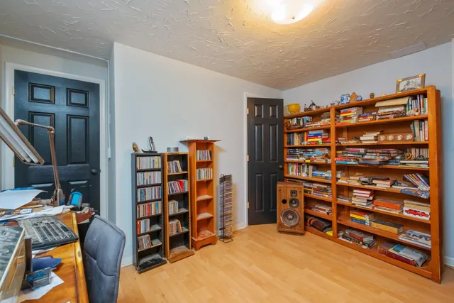 a view of a livingroom with furniture and staircase
