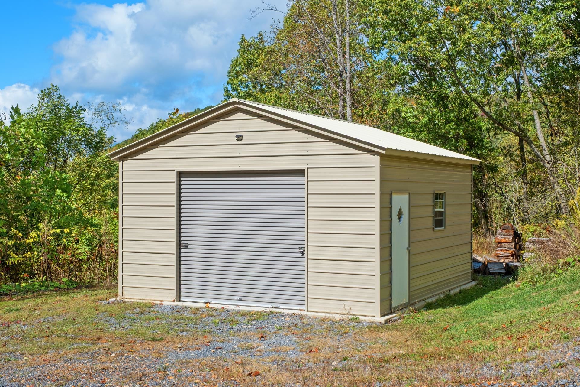 65 Cubbley Road Hot Springs, VA 24445 - Photo 34 of 56 a front view of a house with a yard