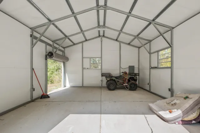 a view of entrance gate and trees