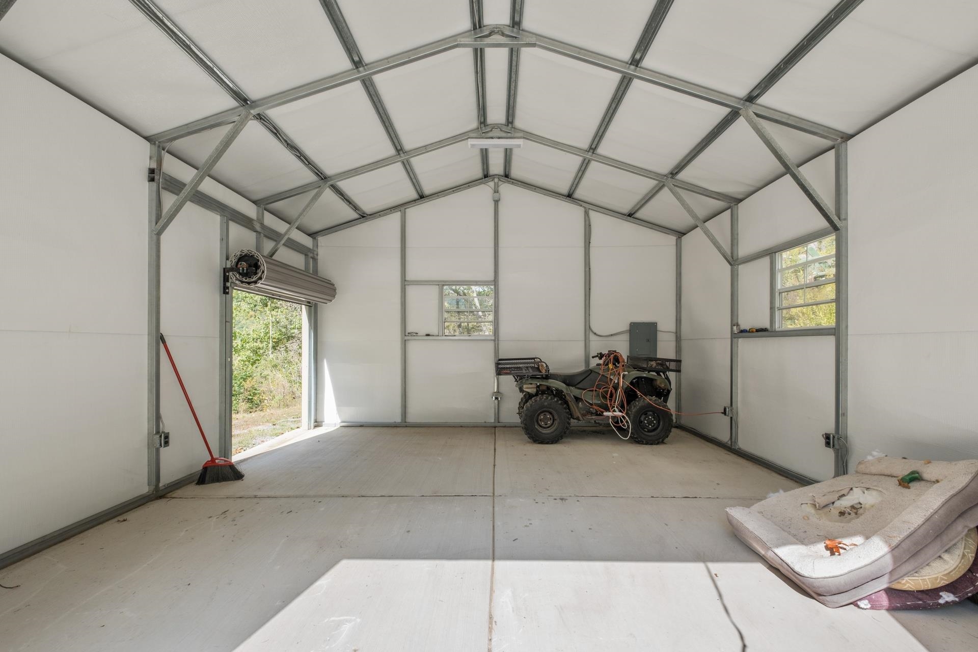 65 Cubbley Road Hot Springs, VA 24445 - Photo 35 of 56 a living room with furniture and a chandelier
