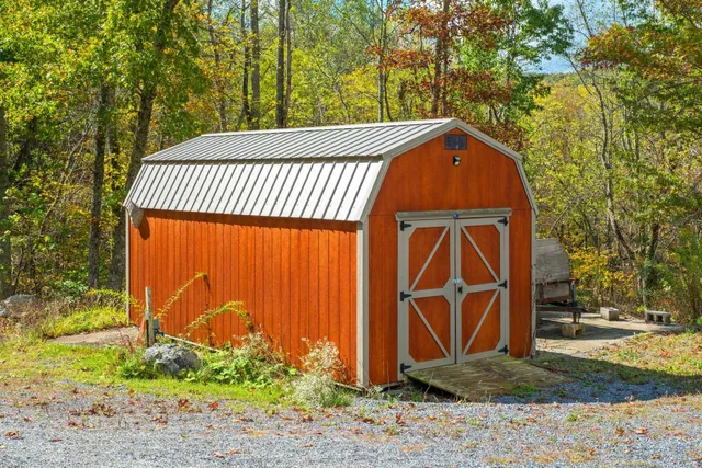 aerial view of a house with yard