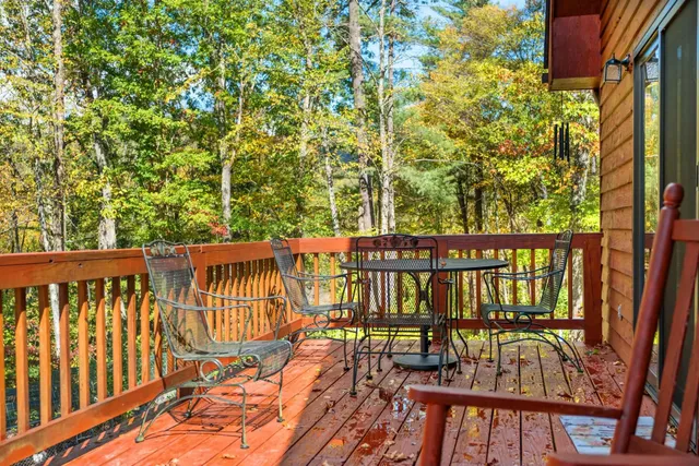 a view of a two chairs on the roof deck