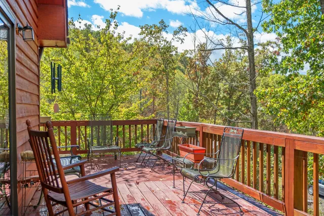 a view of a two chairs in the balcony