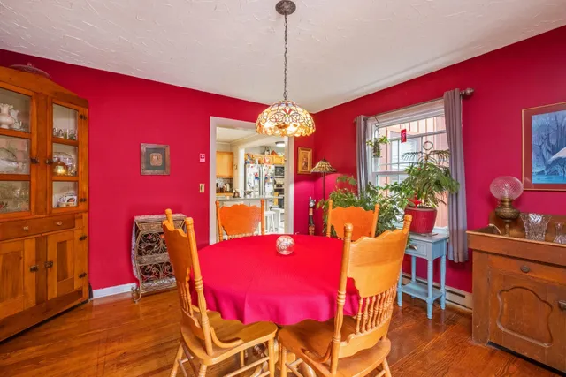 a view of a dining room with furniture and chandelier